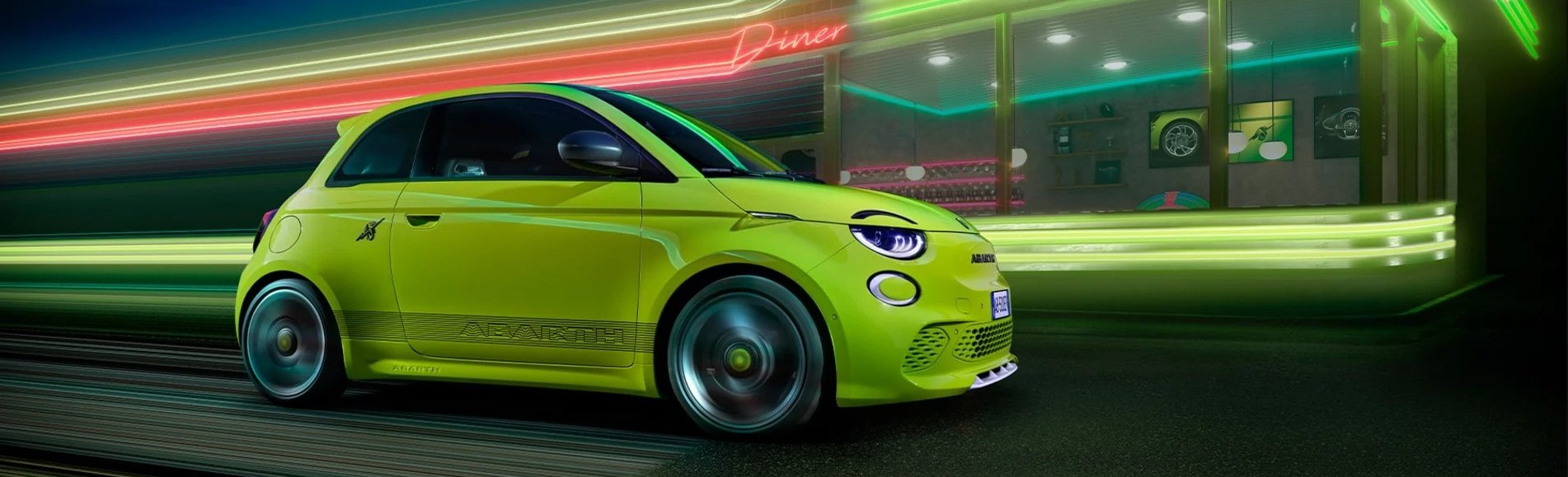 Abarth 500e driving past a diner at speed